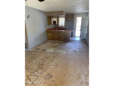 OWNER WILL CARRY. THIS 2BR.CONDO HAS A 1 CAR GARAGE. SOLD AS-IS