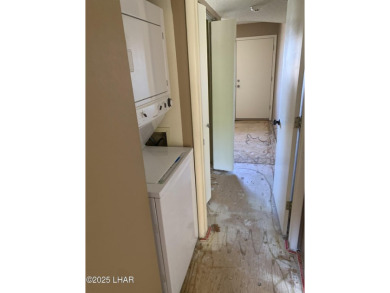 OWNER WILL CARRY. THIS 2BR.CONDO HAS A 1 CAR GARAGE. SOLD AS-IS