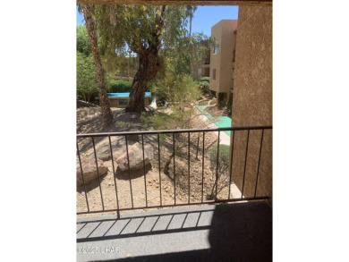 OWNER WILL CARRY. THIS 2BR.CONDO HAS A 1 CAR GARAGE. SOLD AS-IS