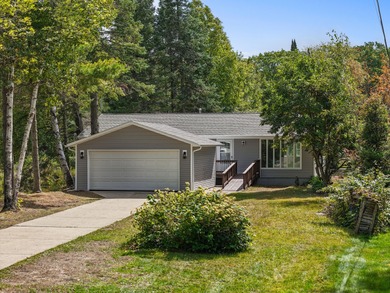 Lovely lakefront home snuggled in the trees for that enticing