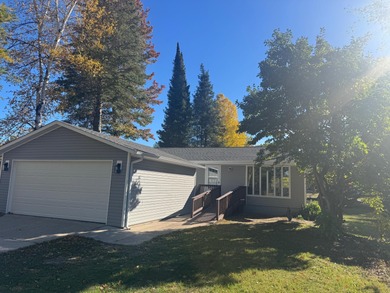 Lovely lakefront home snuggled in the trees for that enticing