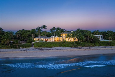 This gated estate is perfectly positioned on over two acres of