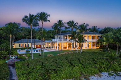 This gated estate is perfectly positioned on over two acres of