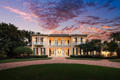 This gated estate is perfectly positioned on over two acres of