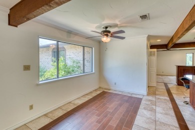 This charming 3 bedroom/2.5 bath home on Lake LBJ is a must see