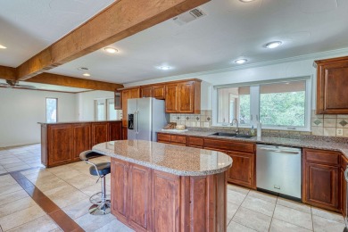 This charming 3 bedroom/2.5 bath home on Lake LBJ is a must see