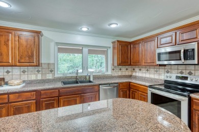 This charming 3 bedroom/2.5 bath home on Lake LBJ is a must see