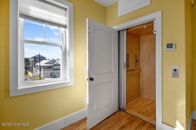 ''A Wave from it All!'' Looking for a refined coastal home where