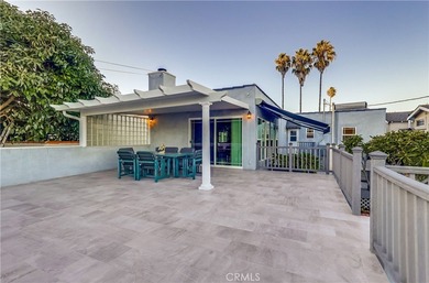 Welcome to this beautifully renovated Spanish-style home