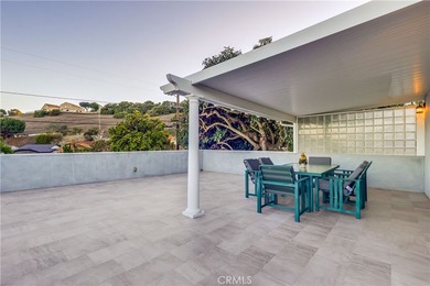 Welcome to this beautifully renovated Spanish-style home