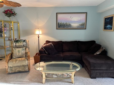 This bright and airy second-floor corner unit is the ideal place