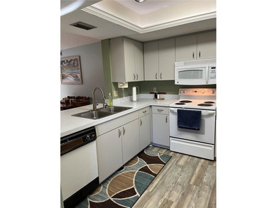 This bright and airy second-floor corner unit is the ideal place