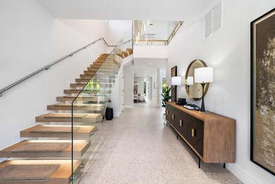 A vision of modern Palm Beach luxury, this brand-new 2025