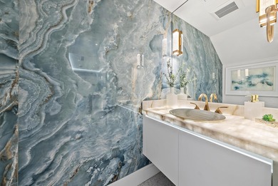 A vision of modern Palm Beach luxury, this brand-new 2025