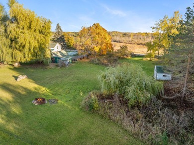 Just south of Cheboygan, this charming 4-bedroom, 2-bath