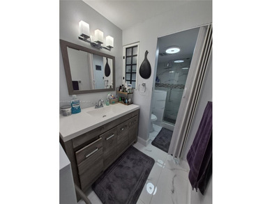 TOP-FLOOR BEAUTY IN THE HEART OF INVERRARY! 
Step into this