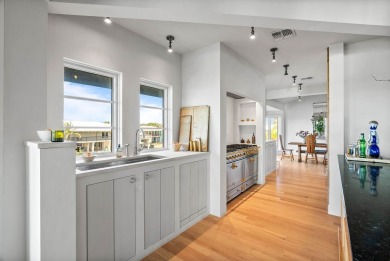 A rare point-lot estate on Key Allegro, blending resort-caliber