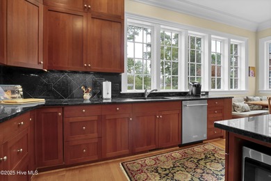 Gorgeous custom-built brick home on a 0.71 acre lot on fairway