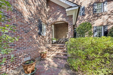 Gorgeous custom-built brick home on a 0.71 acre lot on fairway