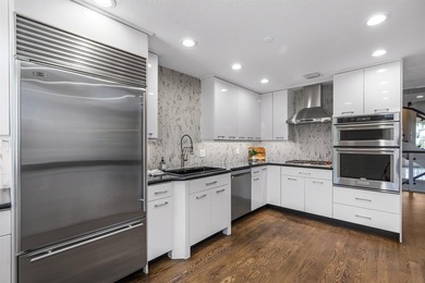 WELCOME HOME TO YOUR PROFESSIONALLY DESIGNED OASIS IN POPULAR