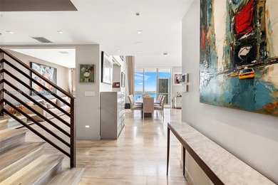 Penthouse 207 is a two-story residence offering expansive