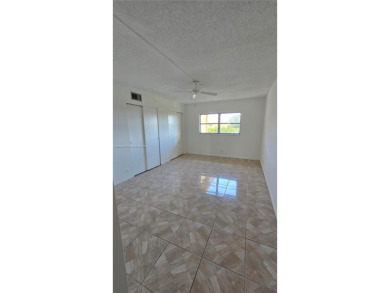 This top-floor unit in the highly sought-after *T* building