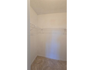 This top-floor unit in the highly sought-after *T* building