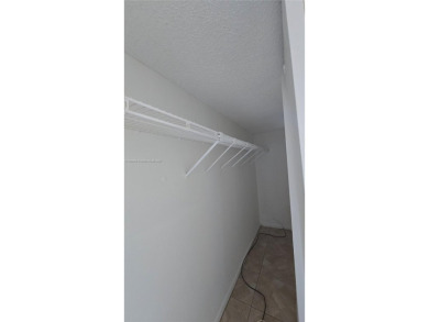 This top-floor unit in the highly sought-after *T* building