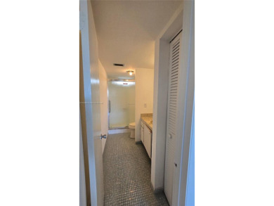 This top-floor unit in the highly sought-after *T* building