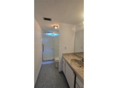 This top-floor unit in the highly sought-after *T* building