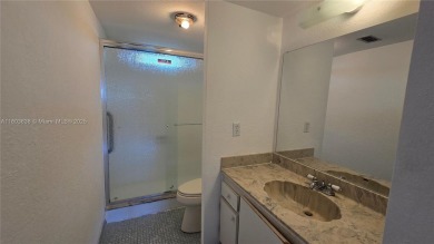 This top-floor unit in the highly sought-after *T* building