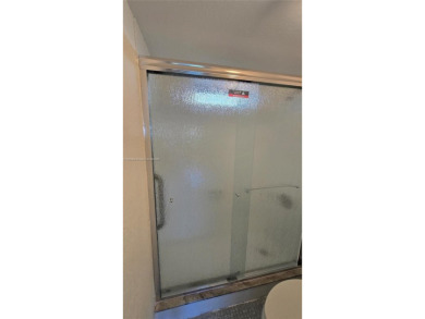 This top-floor unit in the highly sought-after *T* building