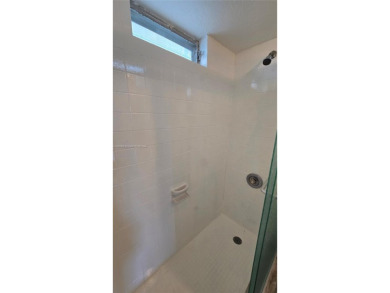 This top-floor unit in the highly sought-after *T* building