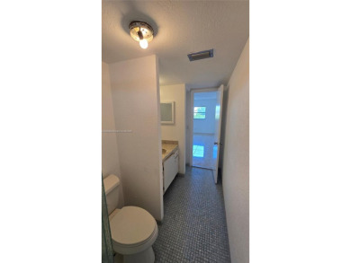 This top-floor unit in the highly sought-after *T* building