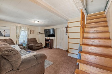 This spacious home sits along the Salmon Falls River, just