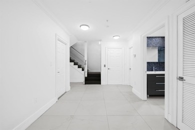 Where elegance meets effortless East Boca Raton living, this