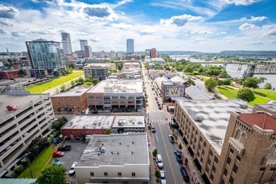 Unique, French Country, Beautiful High Rise Condo in the heart