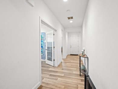 Beautifully maintained and nearly new, this ADA-compliant home