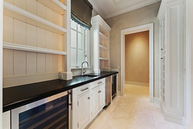 This timeless Euoprean Estate Home sits on 1.6 acres in the