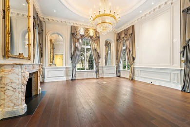 This timeless Euoprean Estate Home sits on 1.6 acres in the