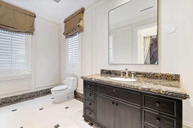 This timeless Euoprean Estate Home sits on 1.6 acres in the