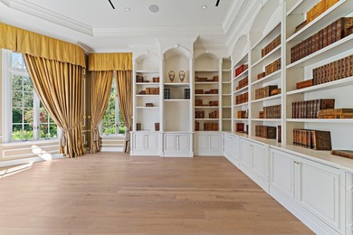 This timeless Euoprean Estate Home sits on 1.6 acres in the