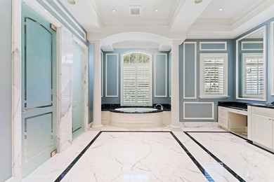 This timeless Euoprean Estate Home sits on 1.6 acres in the