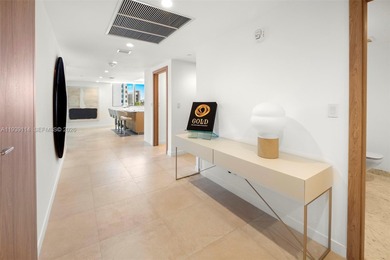 Step into this stunning corner unit at Onda, Bay Harbor's