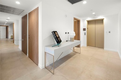 Step into this stunning corner unit at Onda, Bay Harbor's