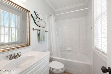 Welcome to this exquisite Charleston-style home nestled in the