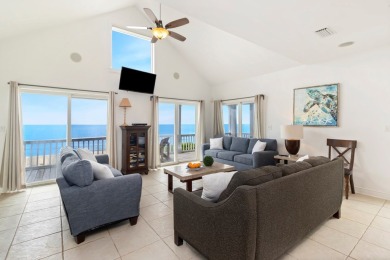 A Beautiful Towering 5 Bedroom Beachfront home located on the