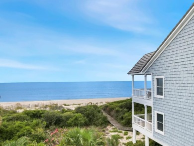 A Beautiful Towering 5 Bedroom Beachfront home located on the