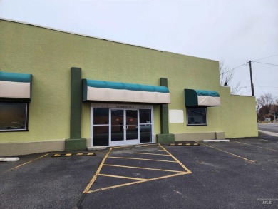 This commercial building is situated on the lighted intersection