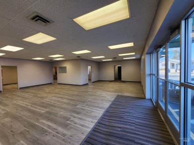 This commercial building is situated on the lighted intersection